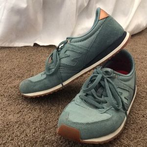 Blue and rose gold New Balance shoes